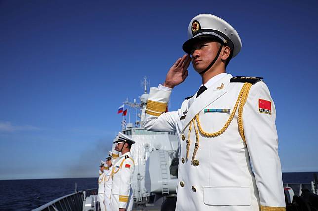 Chinese sailors line up on the deck of the Xian guided-missile destroyer during Russia’s Navy Day parade near St Petersburg on Sunday. Photo: Xinhua