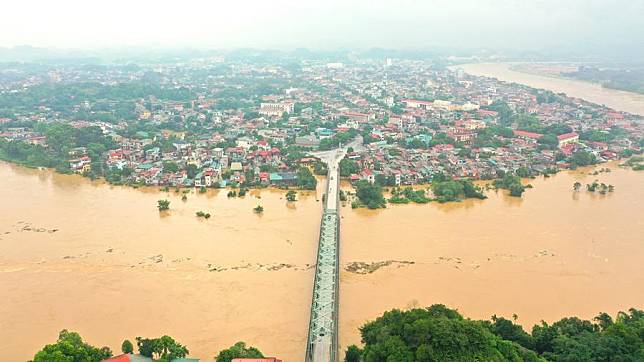 An aerial drone photo shows areas flooded by the rising water of the Red River in Vietnam's northern province of Yen Bai, Sept. 9, 2024. (VNA/Handout via Xinhua)