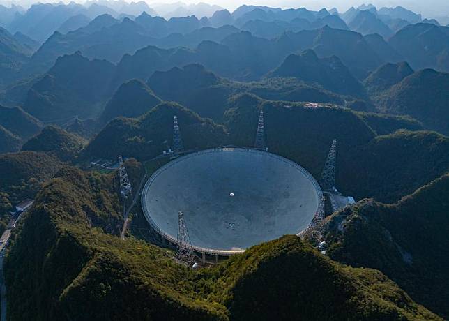 An aerial drone photo taken on Sept. 25, 2024 shows China's Five-hundred-meter Aperture Spherical Radio Telescope (FAST) under maintenance in southwest China's Guizhou Province. (Xinhua/Liu Xu)