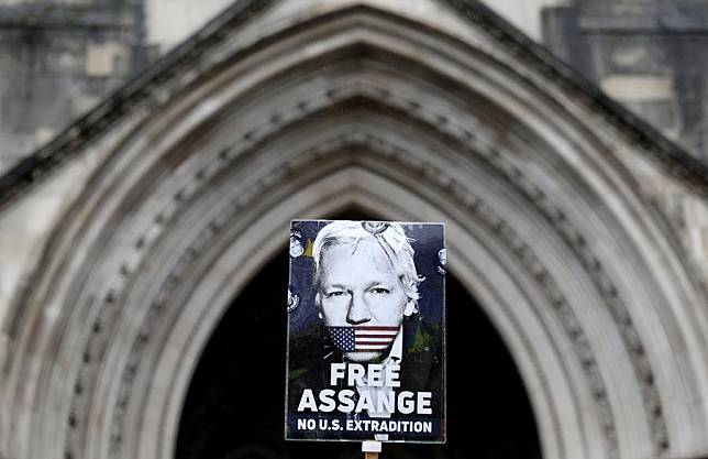 A sign showing support for WikiLeaks founder Julian Assange is seen in a protest outside the United Kingdom (UK) High Court in London, Britain, on Feb. 21, 2024. (Xinhua/Li Ying)