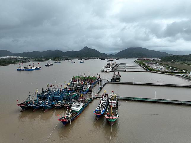 An aerial drone photo taken on Sept. 19, 2024 shows fishing boats docked at a harbor in Jiantiao Township, Sanmen County of Taizhou City, east China's Zhejiang Province. (Xinhua/Weng Xinyang)